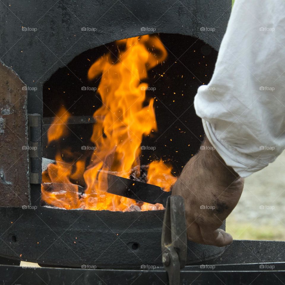 Blacksmith forging metal