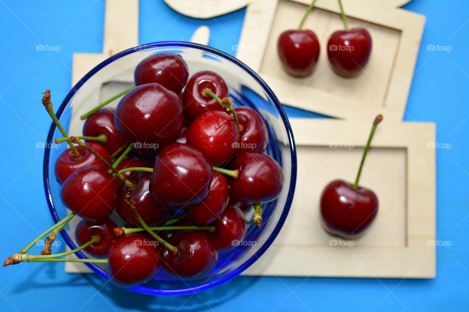 red cherry tasty summer food top view table blue background