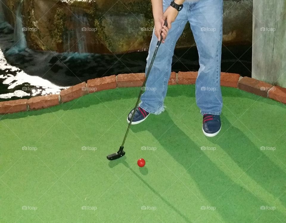 Playing mini golf