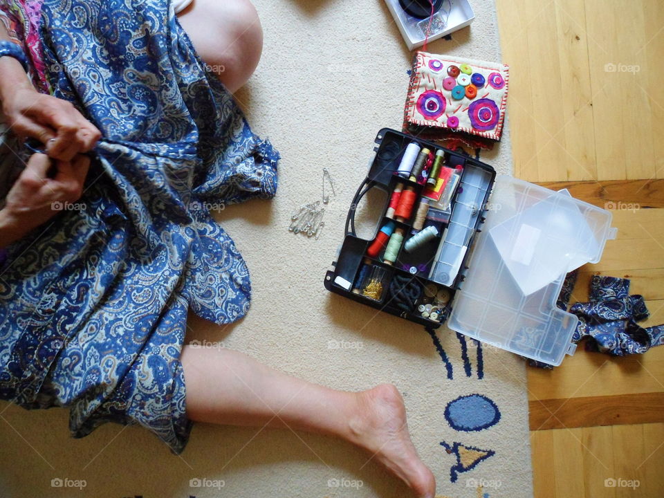 the girl sews a skirt