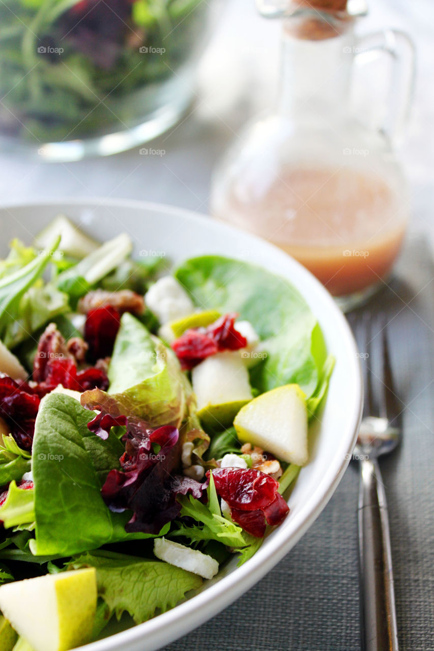 Vegetable salad in bowl on wooden table