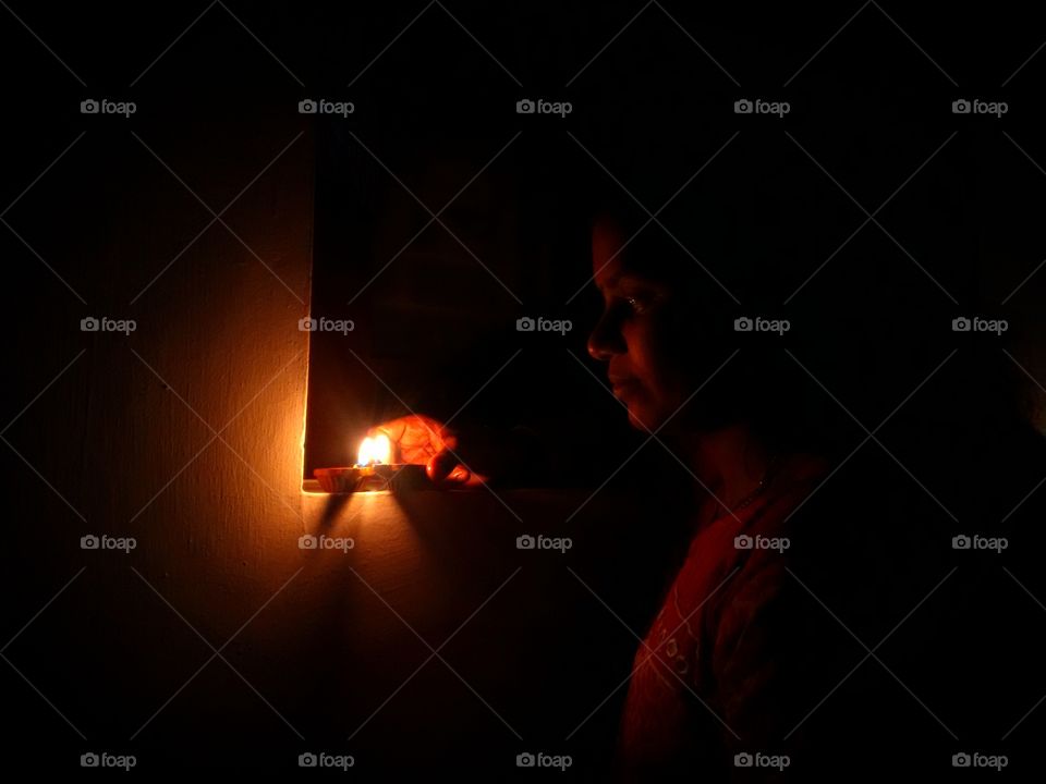 On diwali festival lady lamping