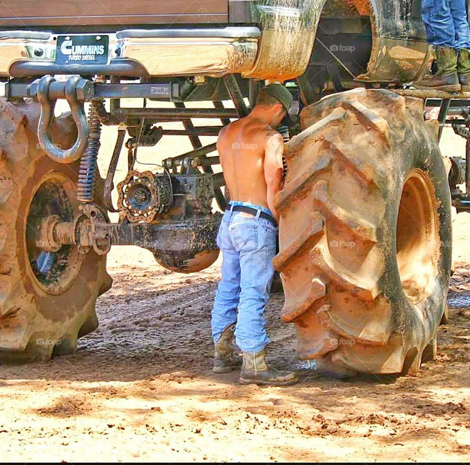 guy peeing on wheel of truck