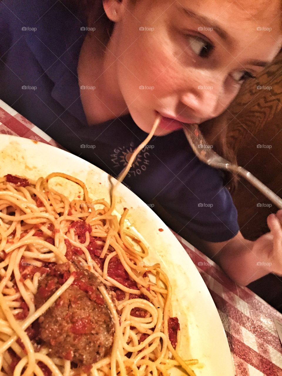 Real girl eating real food spaghetti Italian Restaurant yummy 