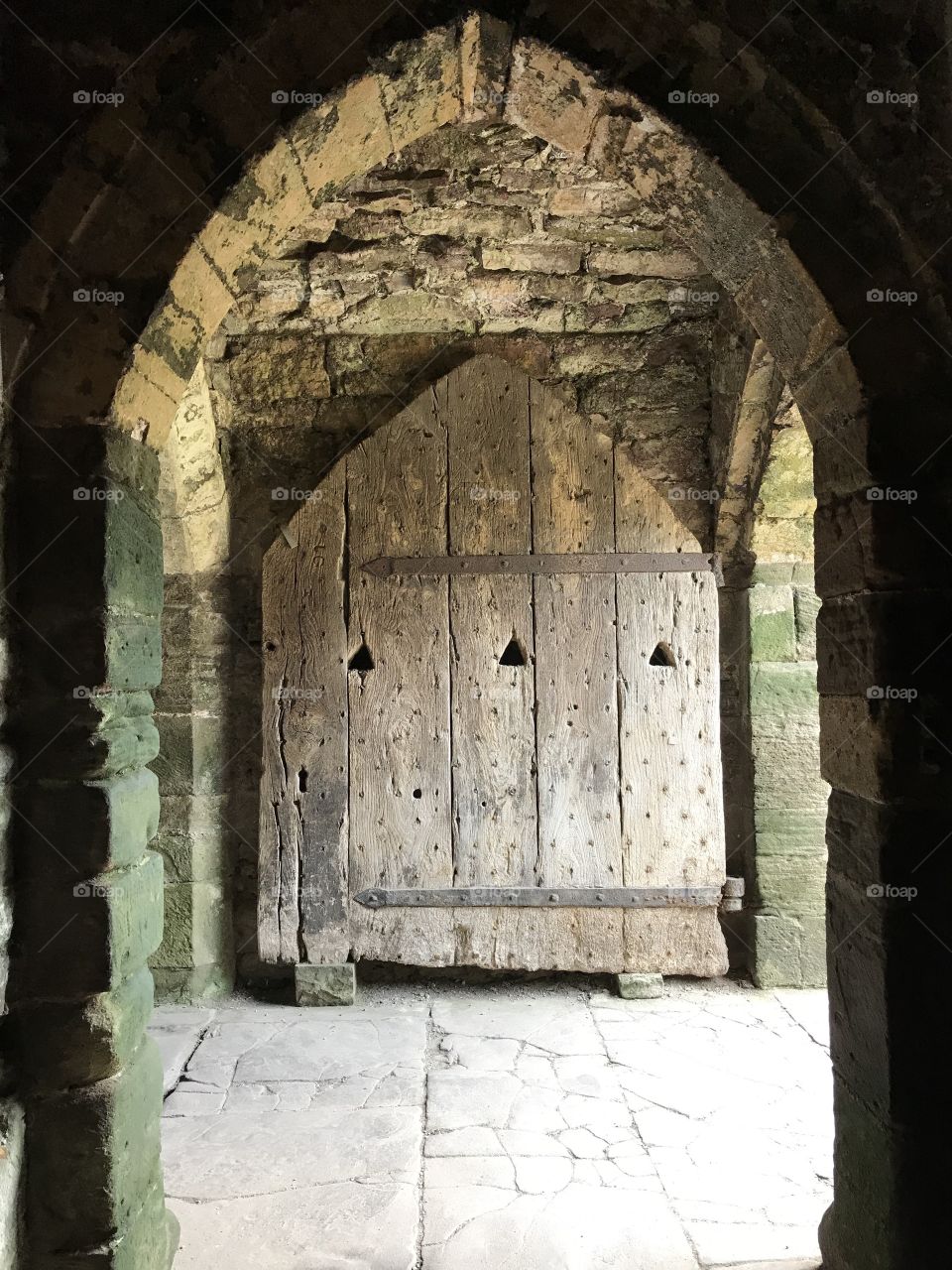 One of the few original doors from the original construction of Chepstow Castle. 
Chepstow, Wales, United Kingdom 