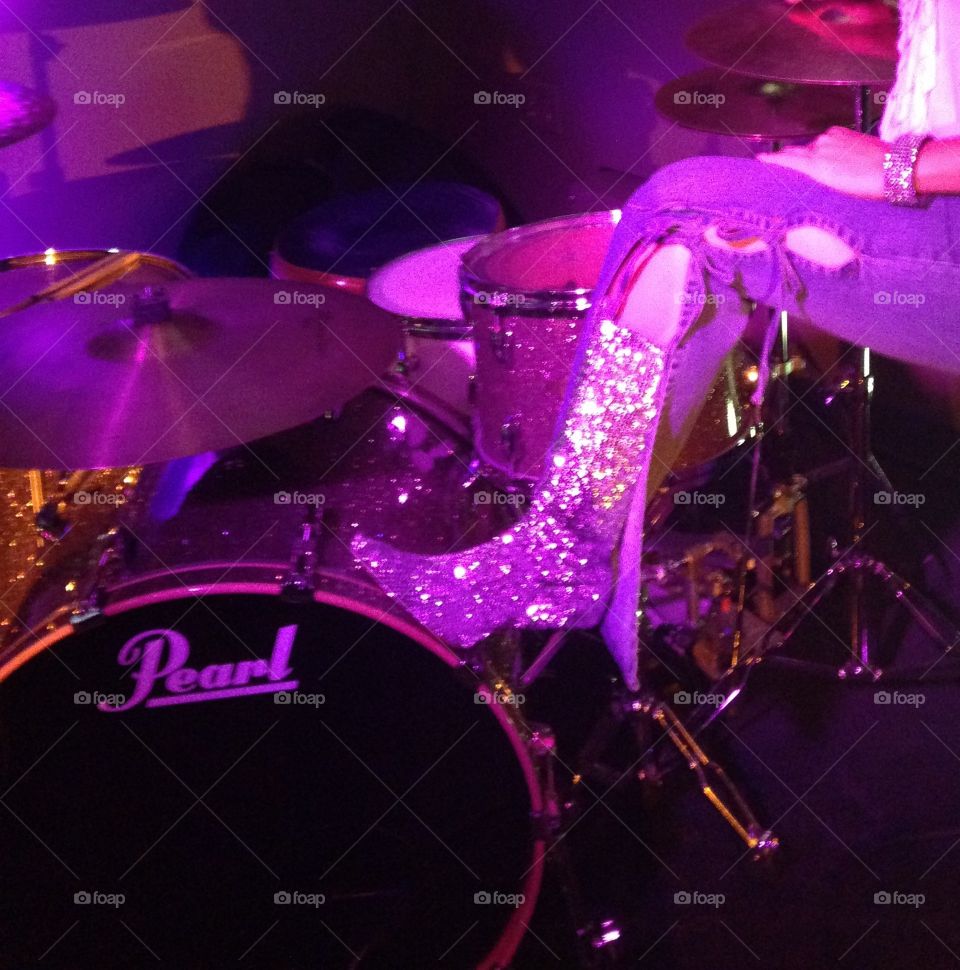 Drum set and sequins in purple light