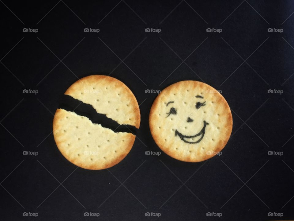 Who is smiling at broken biscuit?