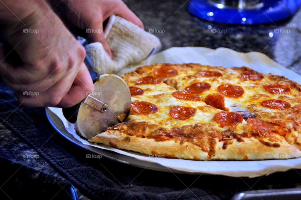 Cutting homemade pizza