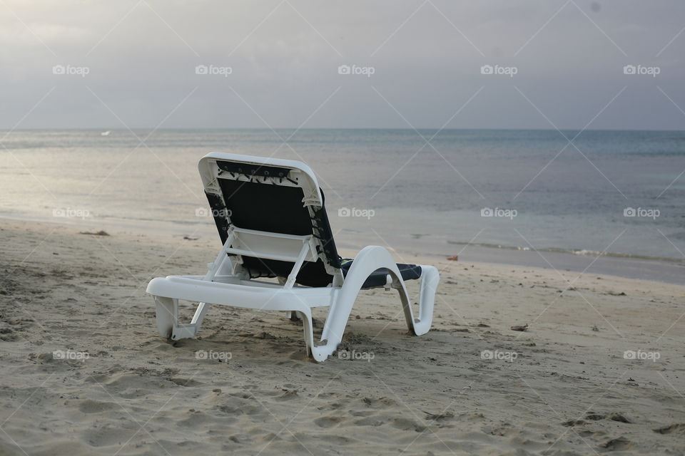 chair on the beach. lonely chair on caribbean sandydream beach