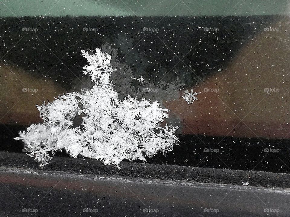 Snowflakes on an icy window