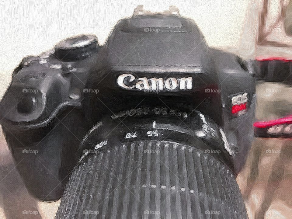 Photograph of a Canon EOS rebel camera. The photograph is taken an edited with a camera filter making it look like an oil painting.
