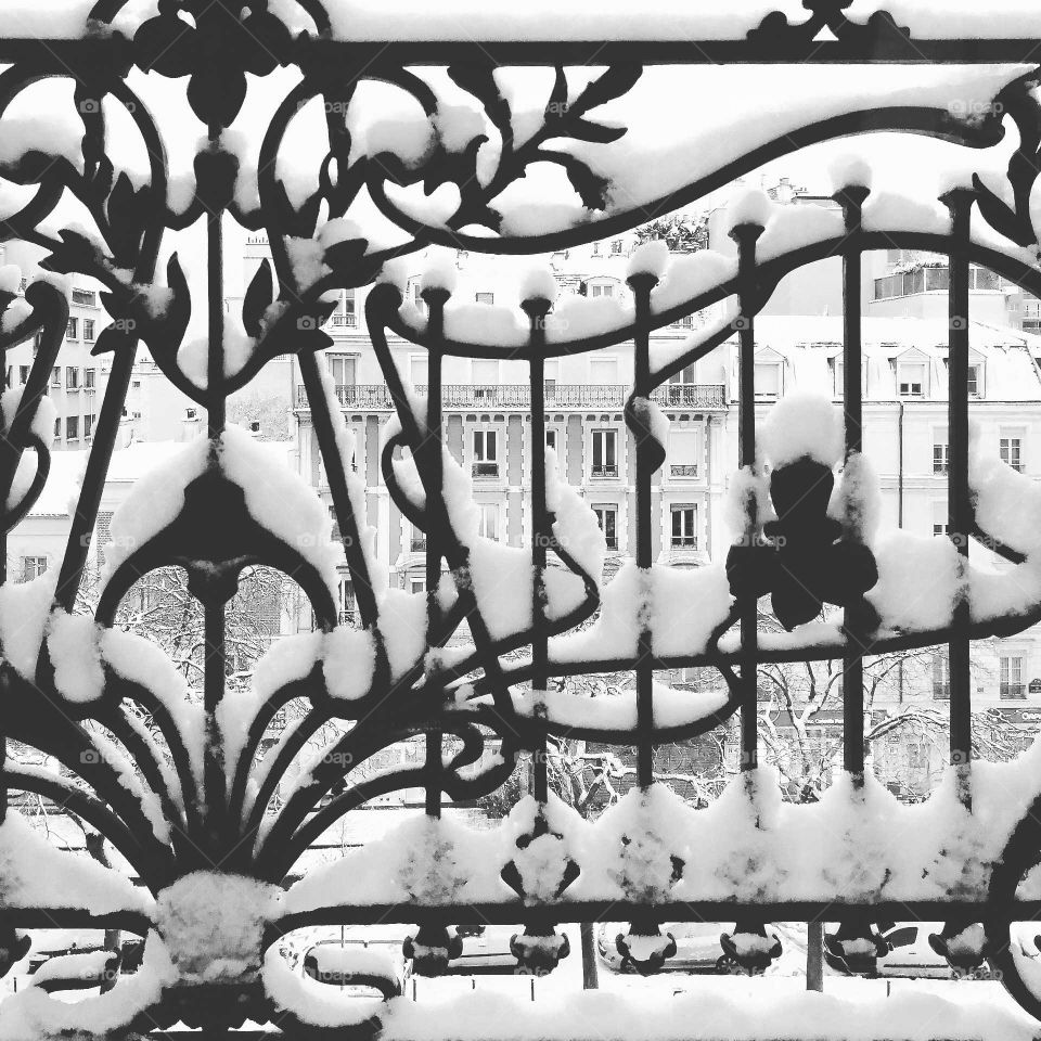 snow balcony view Parisian building black and white art deco french