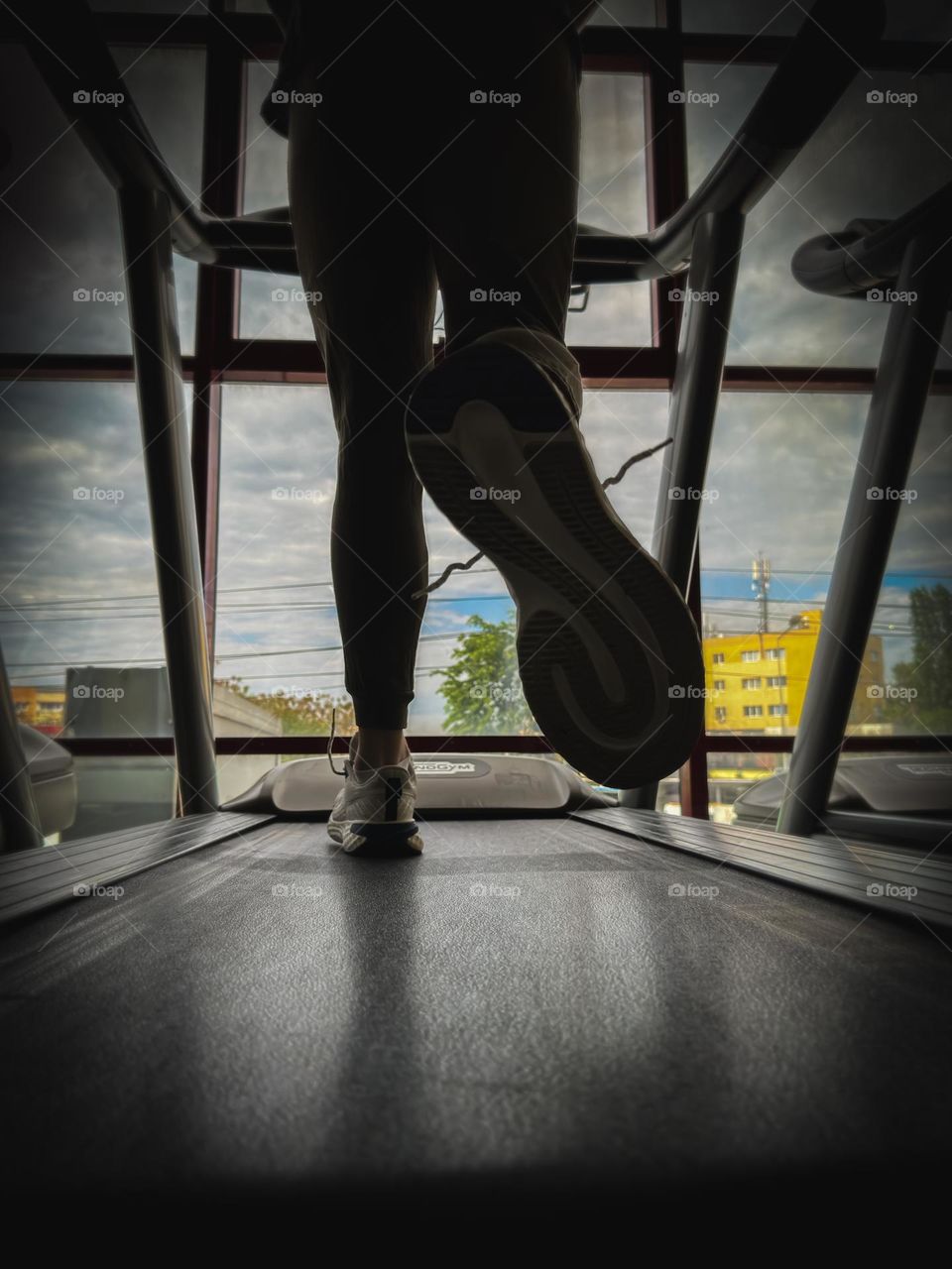 Treadmill workout with a city view 