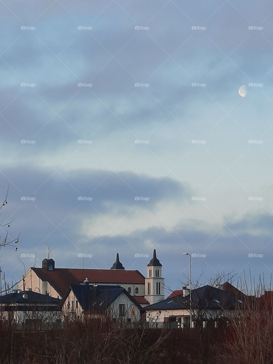 local church at sunrise with vanishing moon