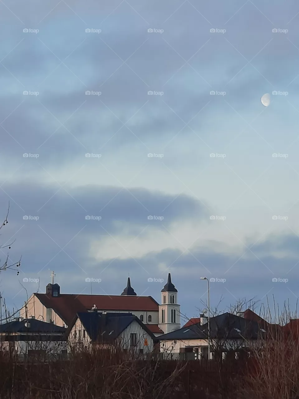 local church at sunrise with vanishing moon
