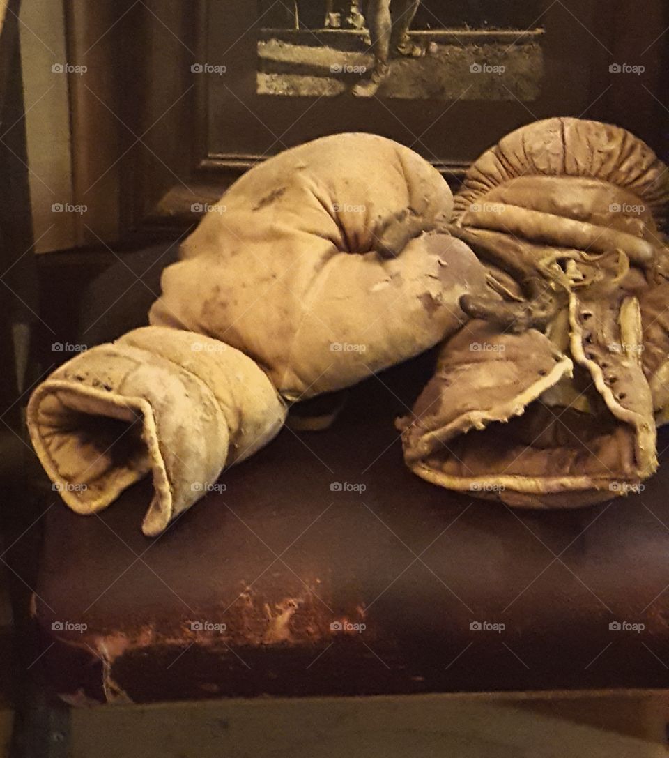 Vintage boxing gloves on display at the Essanay Film Museum. Possibly gloves used in a silent movie . notice the small horseshoe.