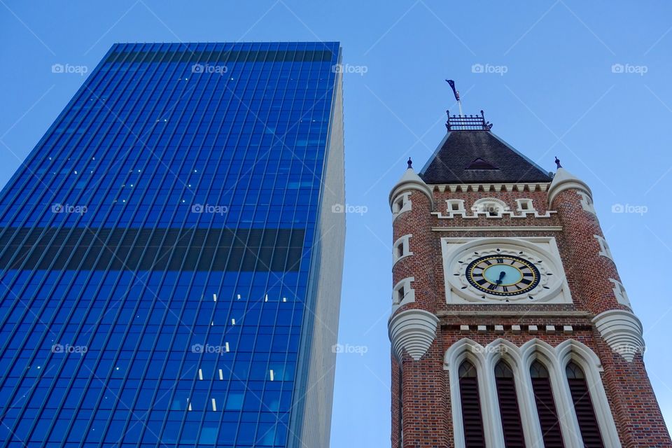 Old architecture, called Perth Town Hall, and contemporary building in Perth, Western Australia.