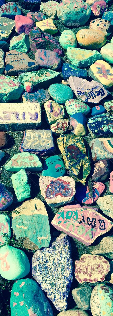 Beautifully painted rocks in honor of a girl who had drowned nearby. Great color and memorial. 