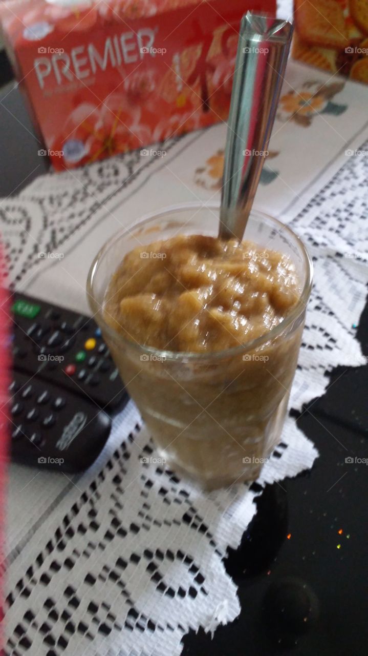 having banana shake while watching tv.