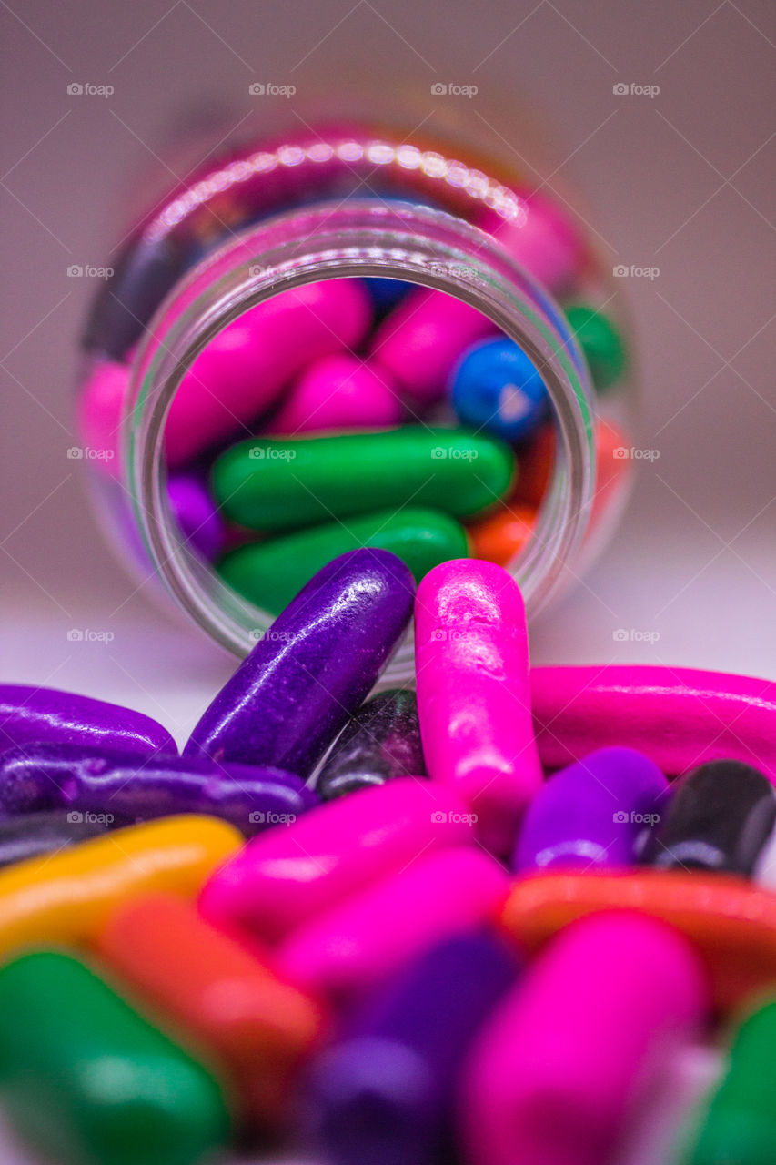 colorful candy thrown out of a bottle