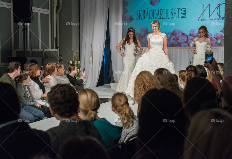 Fashion show at a wedding fair. Here are the latest dresses and clothes for both bride and groom