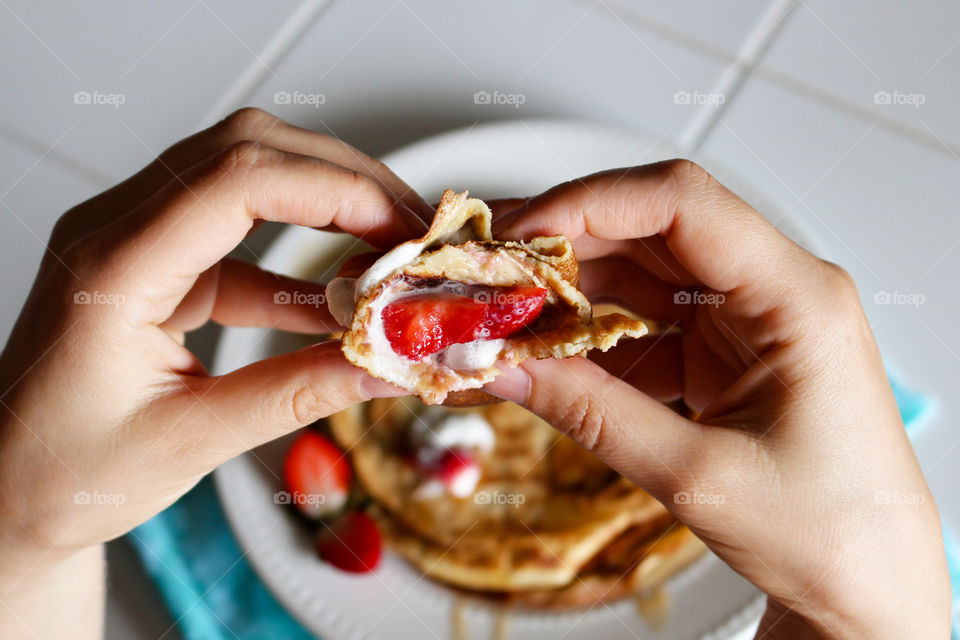 Human hand holding pancake