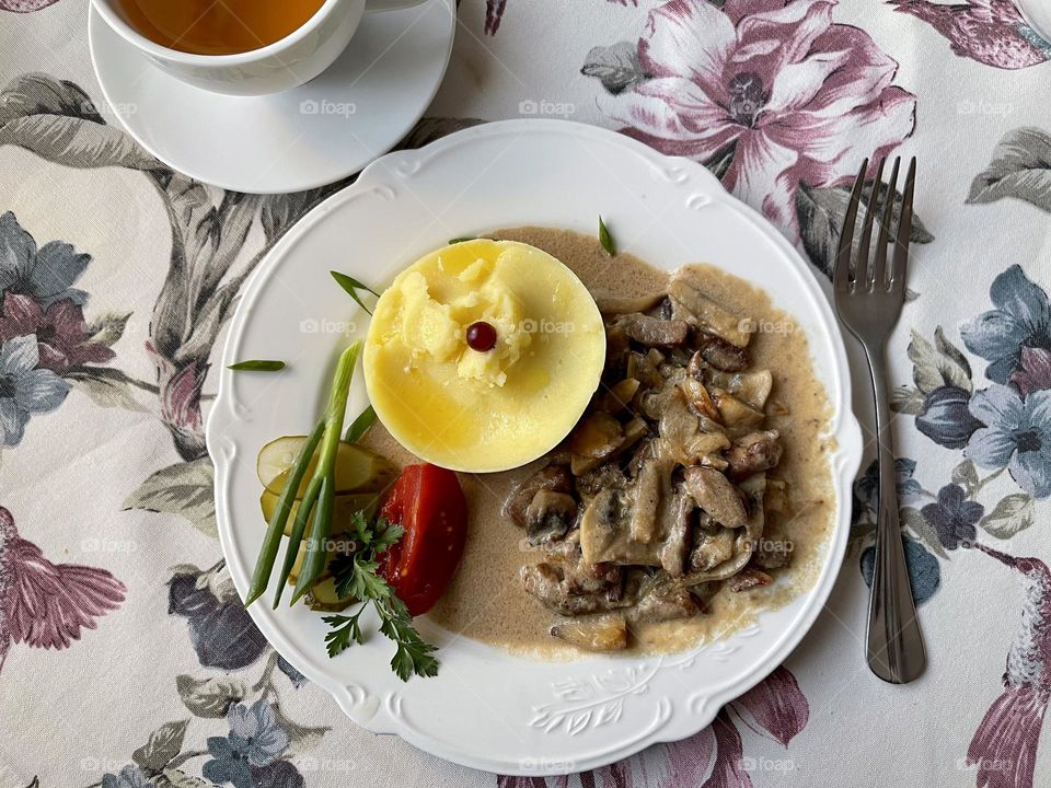 Beef stroganoff with mesh potatoes, top view 