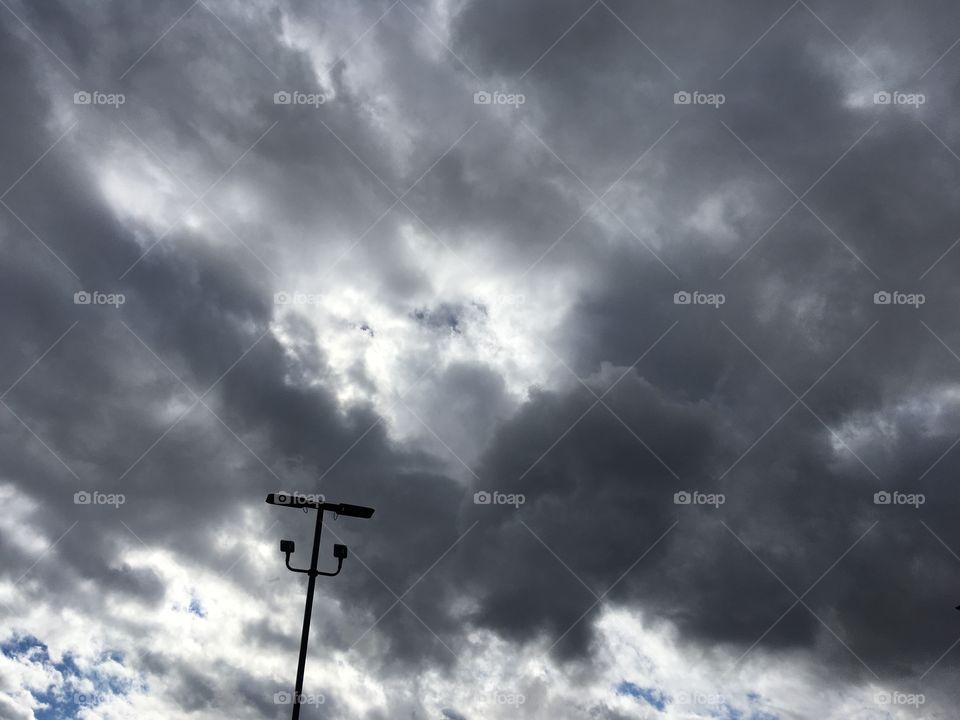Dark puffy clouds looks like a storm coming in is it rain or snow?
