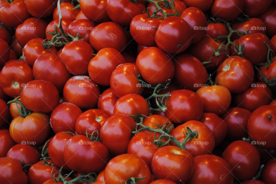 red fresh pile tomatoes by mayakerem