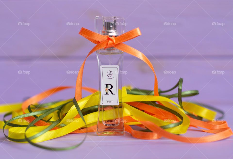 Aesthetic photo of parfum with colorful strips