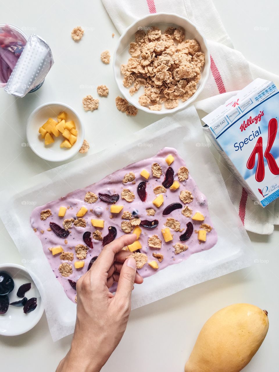 Reimagining cereal : Healthy frozen cereal yogurt bark with Kellogg's Special K.
(Ingredients : Kellogg's Special K, greek yogurt , mango and cherry)
