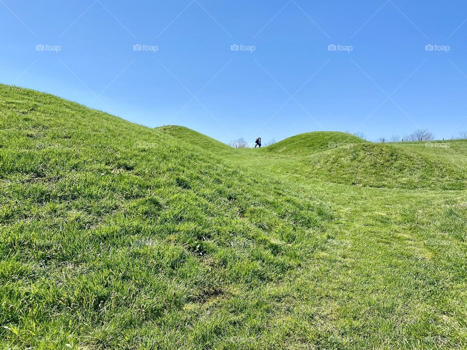 Hills and people walking along a path at a local park