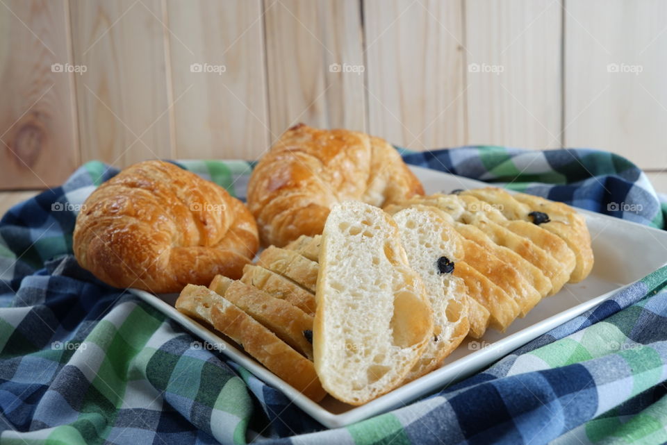 Breakfast bread. Ginger bread and croissant for breakfast