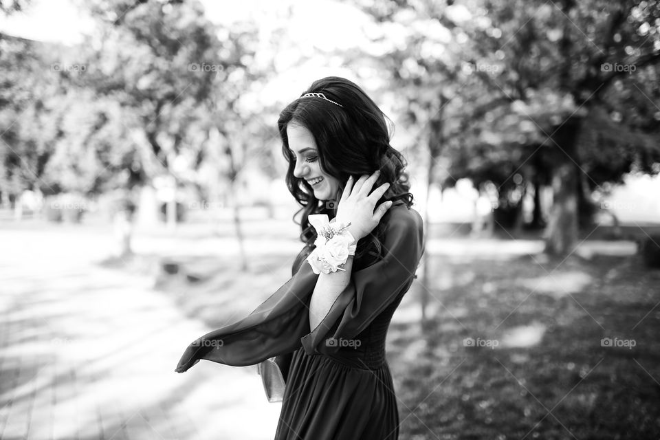 Woman smiling and wearing floral bracelet