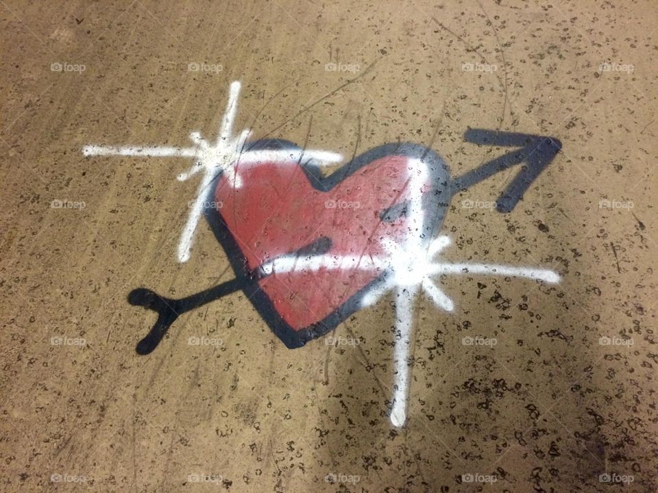 Pierced heart painted on a wall