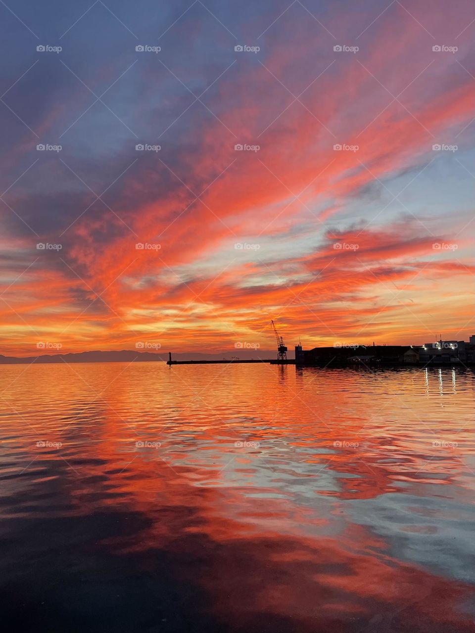 Amazing sunset next to seaport 
