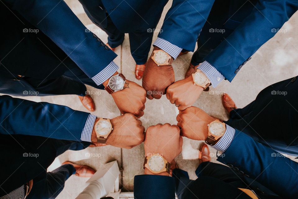 Cool picture of groomsmen at a wedding with their watches.