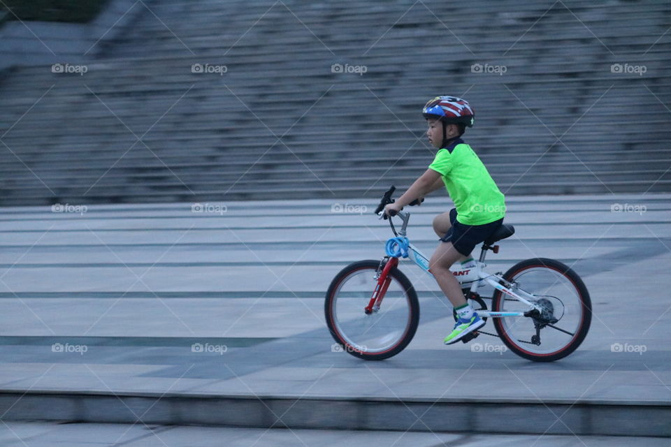 A Kid is Riding bicycle