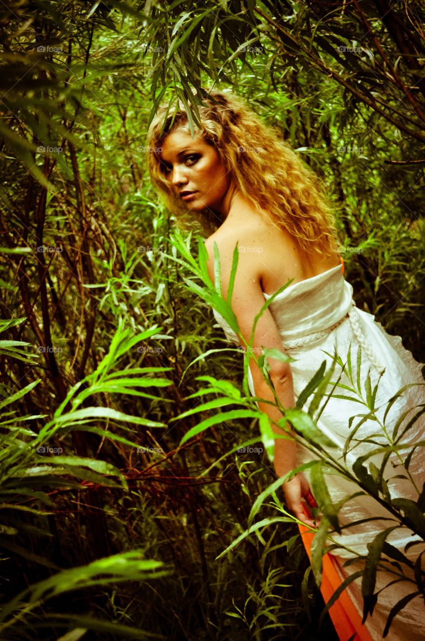 Woman in tropical forest. 