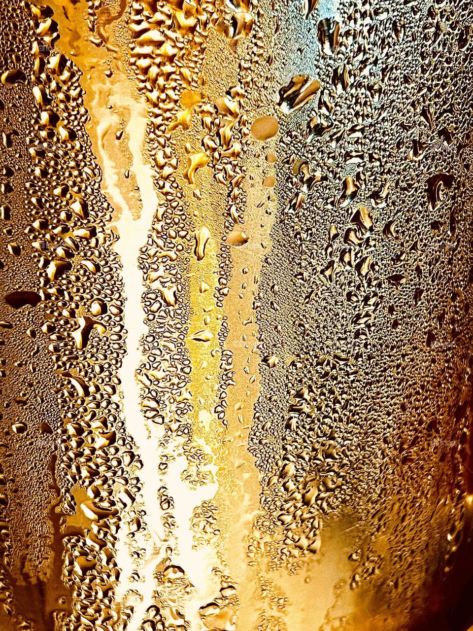 Water drops on golden background