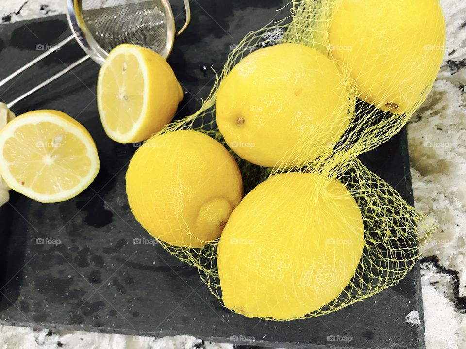 Netted yellow lemons