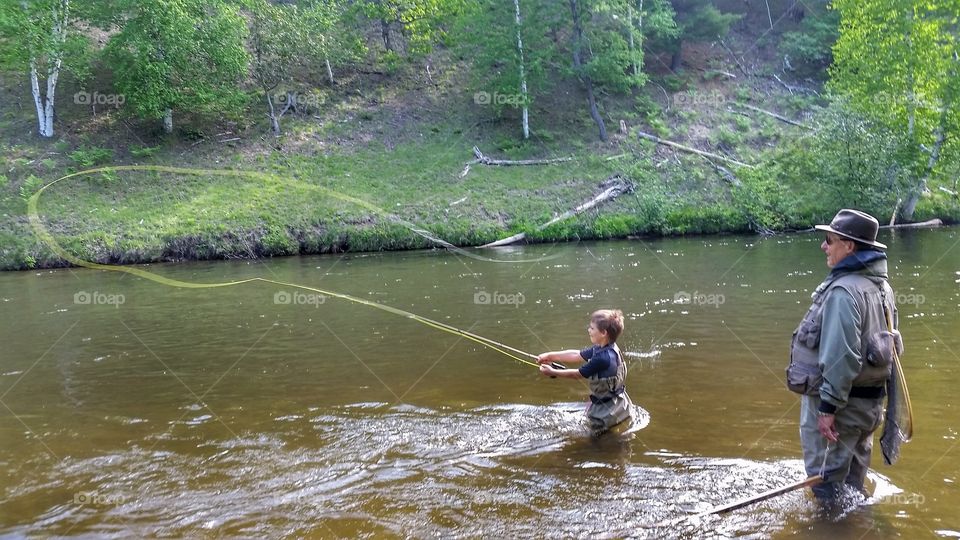teaching grandson to fish