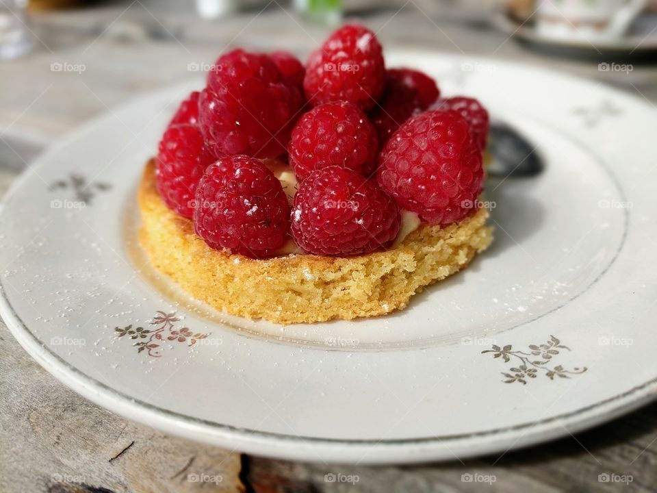 Fresh raspberries on cake a delicious dessert