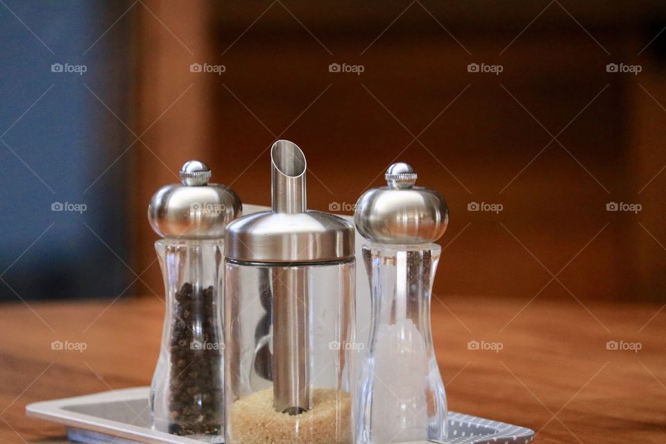 Condiments on tray on restaurant table 