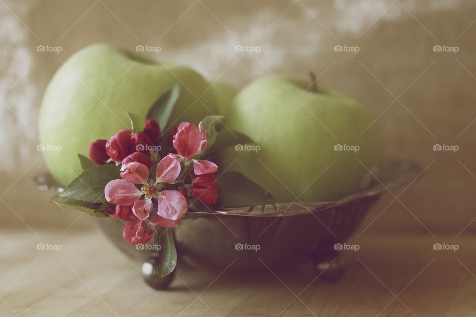 Green apple and flowers