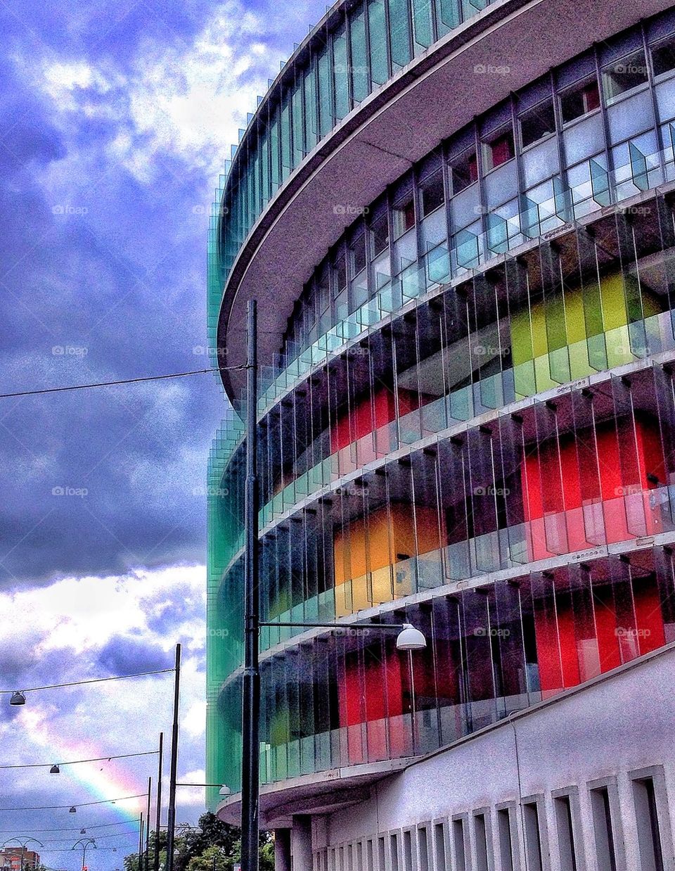 Colourful hospital with rainbow to the left 