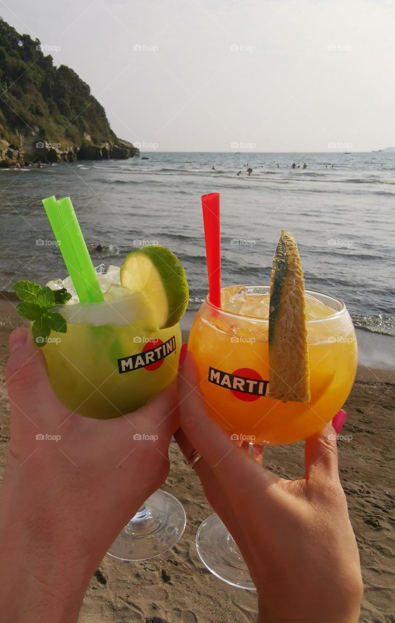 Two tasty cocktails. Seashore. Evening time. Relax and enjoy. Martini.