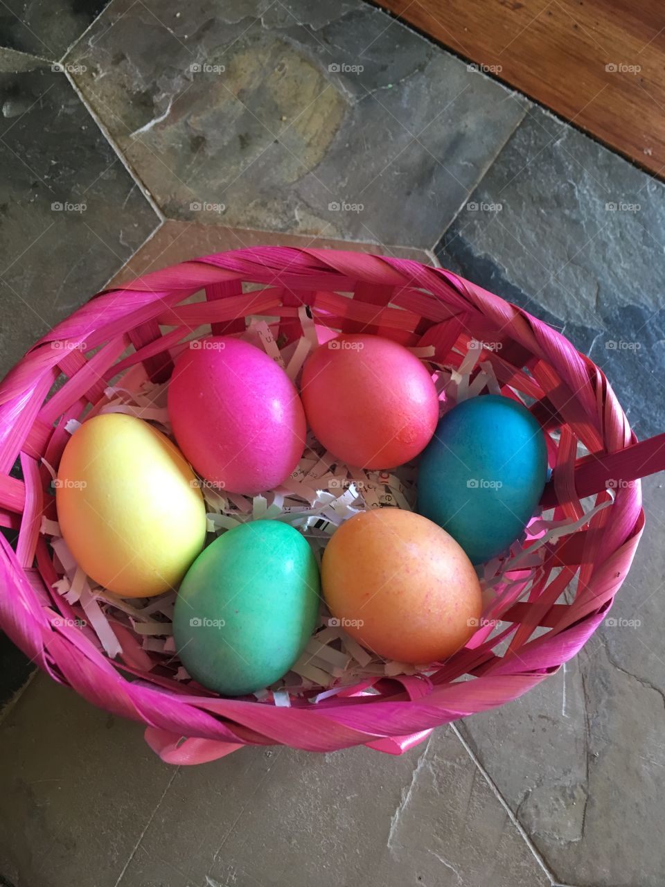 Basket full of colorful eggs