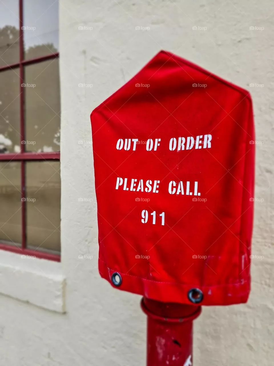 Out of order please call 911 sack put over an old public emergency pull in San Francisco California 