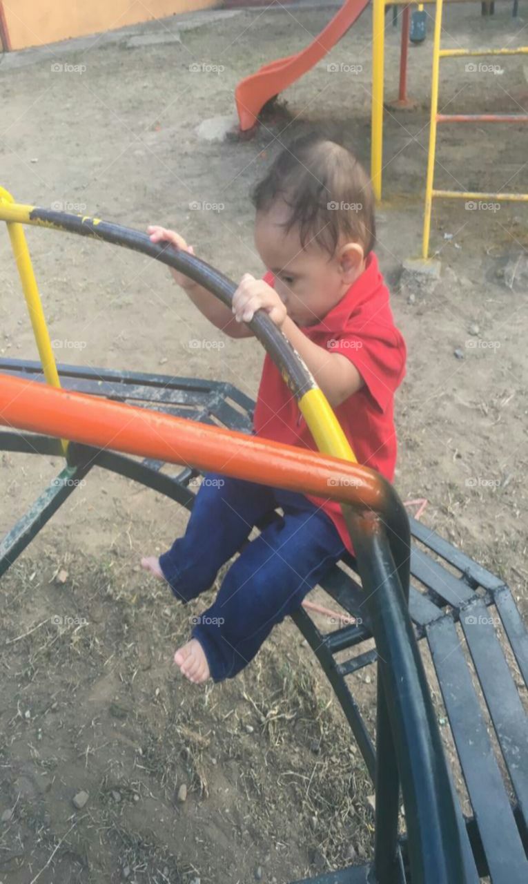 baby playing on the swing